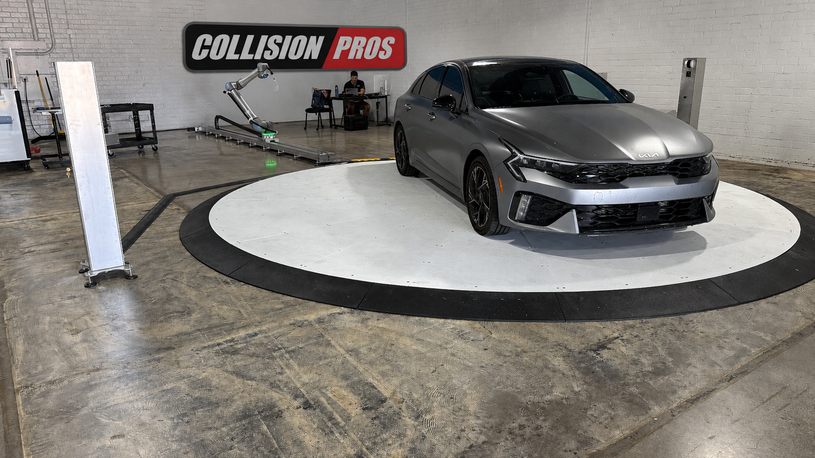 Collision Pros ADAS calibration bay with vehicle on target platform